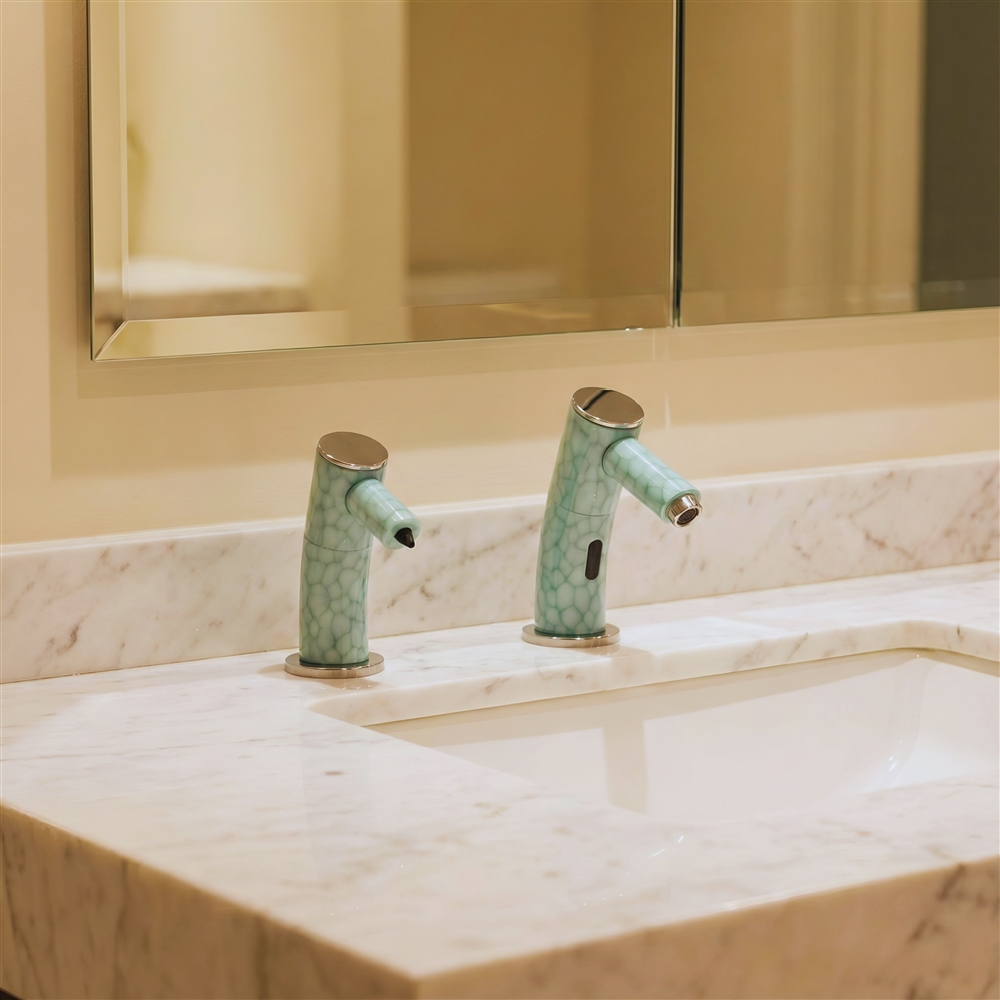 Close-up of durable brushed finish on commercial sensor faucet in luxury restroom