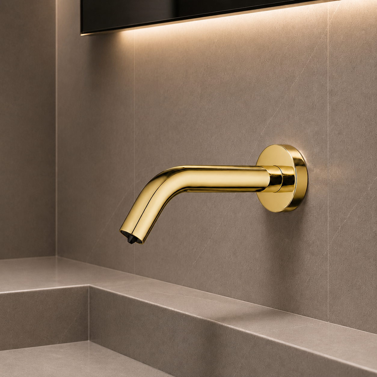 Chrome motion-sensor liquid soap dispenser positioned for public restroom lavatories